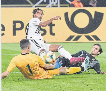  ??  ?? Germany’s Serge Gnabry, centre, scores against Argentina during a friendly match on Wednesday.