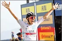  ??  ?? Slovenia’s Tadej Pogacar, wearing the best young rider’s white jersey, crosses the finish line to win Stage 15 of the Tour de France cycling race over 174.5 kms (108.4 miles) from Lyon to Grand Colombier pass, France
on Sept 13. (AP)