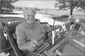  ?? RONNIE BRAMHALL/G.P. PUTNAM’S SONS VIA AP ?? This 2007 image released by G.P. Putnam’s Sons shows author Clive Cussler riding in a classic car. Cussler died on Monday at his home in Scottsdale, Ariz. He was 88.