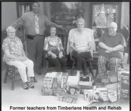  ??  ?? Former teachers from Timberlane Health and Rehab present school supplies to Rev. Antonio Davis from Douglas Chapel Missionary Baptist Church. The supplies were provided by Timberlane and given to students at a Back-To-School Give-A-Way at the church.