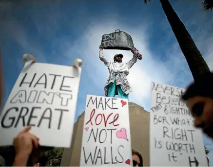  ?? GETTY IMAGES ?? Trump’s wall has polarised American society. Many love it. Many hate it.