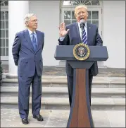  ?? EVAN VUCCI / ASSOCIATED PRESS ?? President Donald Trump and Senate Majority Leader Mitch McConnell, R-Ky., pledge Monday to work together on the Republican goal of overhaulin­g federal taxes.