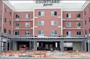  ?? Doug Walker / Rome News-Tribune ?? The U.S. Army Corps of Engineers has finally authorized a Section 408 permit to allow the new Courtyard by Marriott to extend a patio to connect with the Oosanaula River levee.