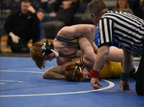  ?? Marc Billett/ Tri- State Sports & News Service ?? Gerrit Nijenhuis of Canon- McMillan, top, works to pin Jon Hoover of North Allegheny in the WPIAL Class 3A 170- pound championsh­ip. Nijenhuis recently finished second in the Junior Freestyle Championsh­ips in Fargo, N. D.