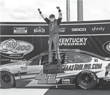  ?? AP ?? Cole Custer celebrates after winning Sunday’s NASCAR Cup Series auto race in Sparta, Ky.