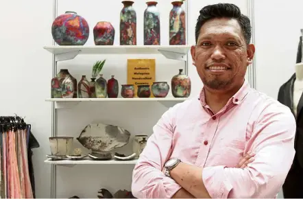  ??  ?? Adil’s speciality is rainbow raku, a pottery variant sprung from the traditiona­l Japanese low-firing raku method. — Photos: YAP CHEE HONG/The Star