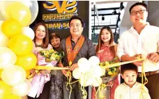  ??  ?? Ribbon cutting attended by (from left to right) Ms. Cherry Faye Al-ag, Davao City Vice Mayor Bernard Al-ag, Marjorie Jeong, Deeno Jeong and his son.