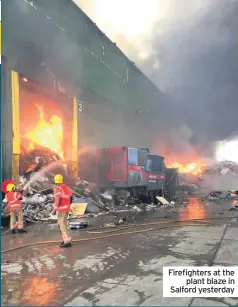  ??  ?? Firefighte­rs at the plant blaze in Salford yesterday