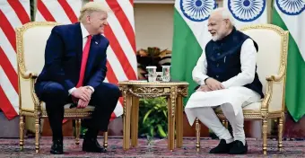  ?? ANI ?? Prime Minister Narendra Modi and US President Donald Trump share a light moment during talks at Hyderabad House in New Delhi on Tuesday. —