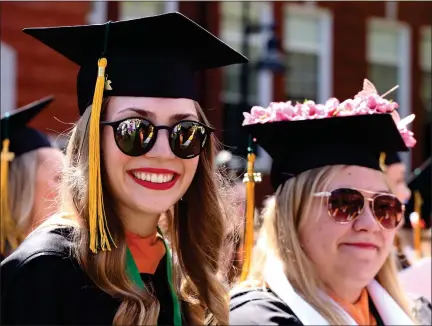  ?? JULIA MALAKIE PHOTOS / SENTINEL & ENTERPRISE ?? Madelyn Covino of Medford, left, and Brianne Cousineau of Turners Falls, both graduating with a Bachelor of Science degree in nursing, attend their Fitchburg State University Commenceme­nt on Saturday.