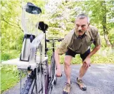  ?? ABBY DREY/CENTRE DAILY TIMES ?? Paul Simpson shows how his homemade blender bike works. The bike makes strawberry milkshakes at the summer Lemont Strawberry Festival.