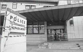  ?? AP/CHRISTOPHE ENA ?? Protest stickers decorate the entrance at a police station Wednesday in Mantes-la-Jolie, France. Police are seeking added compensati­on, saying they are underappre­ciated, overworked and underpaid.