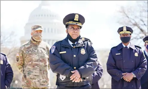  ??  ?? Acting chief of the US Capitol Police Yogananda Pittman listens during a news conference after a car crashed into a barrier on Capitol Hill near the Senate side of the US Capitol in Washington, Friday, April 2. (AP)