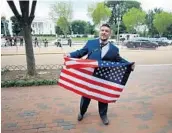  ?? MARK WILSON/GETTY IMAGES ?? Jason Kessler, who organized the alt-right rally, speaks as white supremacis­ts, neo-Nazis, members of the Ku Klux Klan and other hate groups gather.