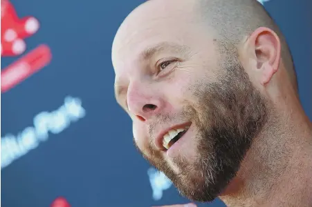  ?? STAFF PHOTOS BY MATT STONE ?? PUTTING ON A BRIGHT FACE: Red Sox second baseman Dustin Pedroia smiles as he talks to the media yesterday on a wide range of topics including his surgically repaired knee, at left.