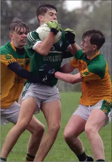  ??  ?? Liam Crowley and Kyle Rankin of Our Lady’s Island/St. Fintan’s pile the pressure on Cloughbawn’s Darragh Kehoe.