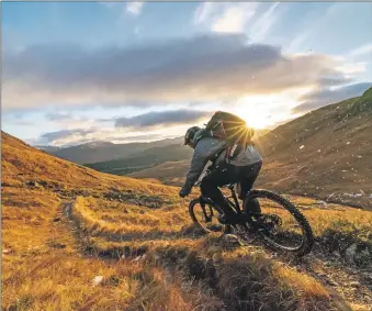  ?? Photograph­s by Andy Cole. ?? Mountain biker Sean 'Griz' Green is halfway through his Munro challenge.
