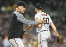  ?? Sean M. Haffey / Getty Images ?? Manager Bruce Bochy pulls Ty Blach, who had a no-hitter going into the fifth, but eventually gave up four runs.