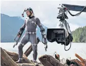  ??  ?? Andy Serkis in his motion capture suit filming for War for the Planet of the Apes, in which he plays Caesar, right, the saga’s hero