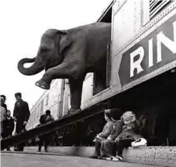  ??  ?? In this April 1, 1963 file photo, a Ringling Bros Circus elephant walks out of a train car as young children watch in the Bronx railroad yard in New York. — AP photos