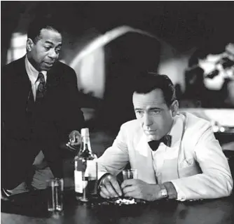  ??  ?? Humphrey Bogart as Rick and Dooley Wilson as Sam in Casablanca: No. 2 on all-time list.