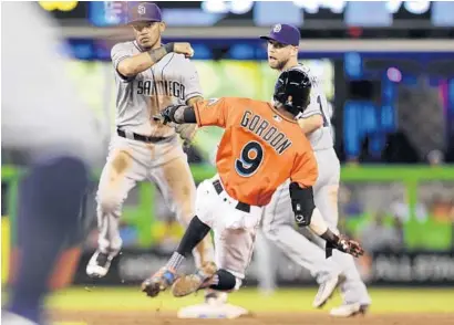  ?? MATIAS J. OCNER/TNS ?? Miami Marlins’ Dee Gordon is forced at second on one of the six double plays the Marlins hit into in Sunday’s 3-1 loss to the San Diego Padres.