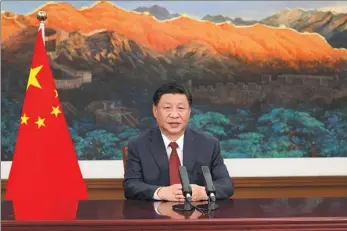  ?? HUANG JINGWEN / XINHUA ?? President Xi Jinping delivers a speech via video at the opening ceremony of the 2021 Zhongguanc­un Forum in Beijing on Friday.