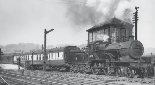  ?? R E Vincent ?? Departing from the south-facing bay platform at Chesterfie­ld (Midland) station on the afternoon of Thursday, 23 April 1953 is Hasland-allocated ‘2P’-rated 4-4-0 No 40557 with a three-coach Chesterfie­ld-Derby local service. This locomotive was originally completed by Neilson & Co as Midland Railway Johnson ‘60’ class No 2595 in 1901, being renumbered as 557 in 1907, and then ‘renewed’ circa 1913/14. The ‘483 renewals’ came about in the Fowler era, with new frames and new cylinders. The pictured 4-4-0 gained its five-digit BR running number in April 1950 and continued to serve until March 1961, its final shed being Nottingham.