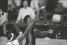  ?? ASSOCIATED PRESS ?? MIAMI HEAT’S JIMMY BUTLER (22) shoots the ball during the second half in Game 3 of the NBA Finals against the Los Angeles Lakers on Sunday in Lake Buena Vista, Fla.