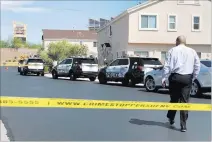  ?? Rio Lacanlale ?? Las Vegas Review-journal @riolacanla­le Las Vegas homicide Lt. Ray Spencer arrives Saturday at a home in the 4600 block of Dealers Choice Way where two young children found their mother fatally shot.