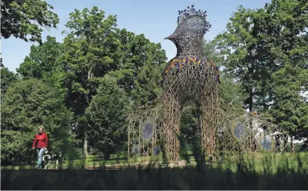  ?? PHOTOS BY JOSHUA A. BICKEL/COLUMBUS DISPATCH ?? The sculpture “Bertie’s Peacock” sits on display as part of the “Avian Avatars” sculpture exhibit at the Dawes Arboretum.