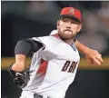  ??  ?? Diamondbac­ks pitcher Alex Young throws against the Rockies in the first inning Sunday in Phoenix.