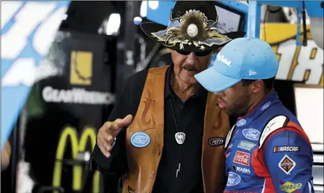  ?? PHOTO/MATT SLOCUM ?? In this June 9 file photo, Richard Petty (left) talks Darrell Wallace Jr. during practice for the NASCAR Cup Series Pocono 400 auto race in Long Pond, Pa. AP