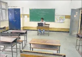  ??  ?? A teacher takes an online class at a Delhi government school in July last year.