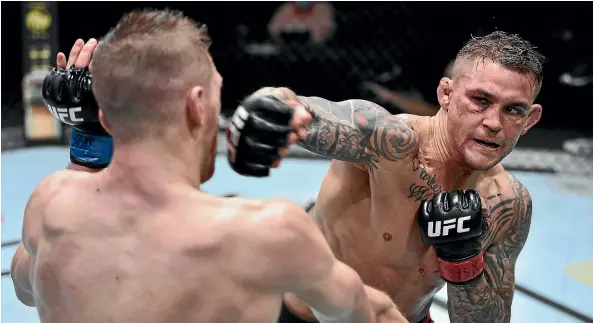  ??  ?? Above, Dustin Poirier aims a right at Dan Hooker during their dramatic UFC clash in Las Vegas.
Left, Poirier celebrates his win by a unanimous points decision.