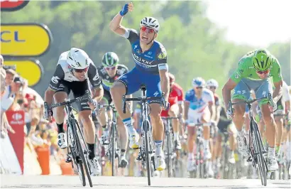  ?? Photograph: Getty ?? Mark Cavendish, left, wins stage 14 but Macel Kittel, centre, is not happy