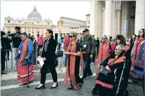  ?? GREGORIO BORGIA/ASSOCIATED PRESS FILE PHOTO ?? President of the Metis community, Cassidy Caron, second left, arrives to St. Peter’s Square in March after meeting with Pope Francis. The pope’s trip to Canada to apologize for the horrors of church-run Indigenous residentia­l schools begins today.