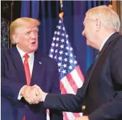  ?? ALEX BRANDON/AP ?? Former President Donald Trump shakes hands with GOP Sen. Lindsey Graham on Saturday in Columbia, S.C., after an earlier campaign stop in New Hampshire.