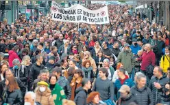  ?? AFP ?? Demonstrat­ors hold a banner reading “do not touch children” to protest against the health pass and Covid-19 vaccines for children, in the Spanish Basque city of San Sebastian.