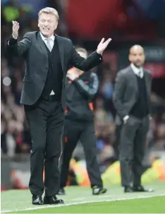  ?? — AFP ?? This file photo taken on April 01, 2014 shows Manchester United’s Scottish manager David Moyes (left) gestures on the touchline during the UEFA Champions League quarterfin­al first leg at Old Trafford in Manchester.