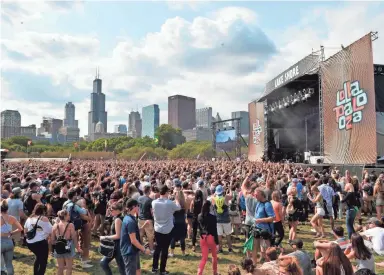  ?? ASSOCIATED PRESS ?? Fans watch as Charlie XCX performs on Day 4 at Lollapaloo­za in Grant Park on Aug 6, 2017, in Chicago.