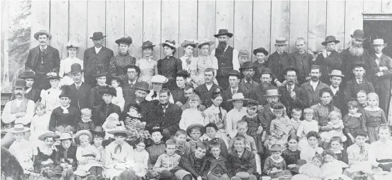  ?? IMAGE C-07983 COURTESY OF ROYAL BRITISH COLUMBIA MUSEUM AND ARCHIVES ?? Langley-area residents gather for a picnic and a photograph at about the time when John Montgomery moved there from Manitoba.