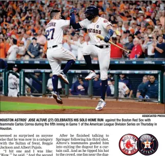  ?? ASSOCIATED PRESS ?? HOUSTON ASTROS’ JOSE ALTUVE (27) CELEBRATES HIS SOLO HOME RUN against the Boston Red Sox with teammate Carlos Correa during the fifth inning in Game 1 of the American League Division Series on Thursday in Houston.