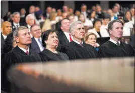  ?? Doug Mills The Associated Press ?? Supreme Court Justices John Roberts, Elena Kagan, Neil Gorsuch and Brett Kavanaugh look on as President Donald Trump gives his State of the Union address.