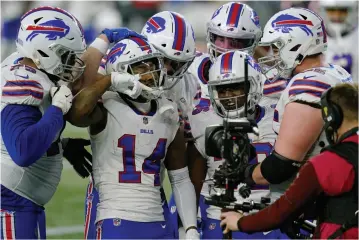  ?? AP PHOTO ELISE AMENDOLA ?? Buffalo Bills wide receiver Stefon Diggs (14) celebrates his touchdown with teammates in the second half of an NFL football game against the New England Patriots, Monday in Foxborough, Mass. The Bills won the game 38-9.