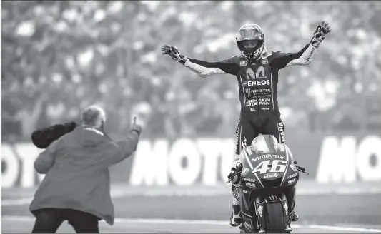 ?? Photo: CFP ?? Italy’s MotoGP rider Valentino Rossi celebrates after winning the Dutch Grand Prix at the TT circuit in Assen, the Netherland­s on Sunday.