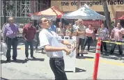  ?? PHOTO BY SAL PIZARRO ?? Chico State student Jordan Callender spits a cherry pit 34 feet at the San Jose Downtown Farmers Market in San Pedro Square on Friday.