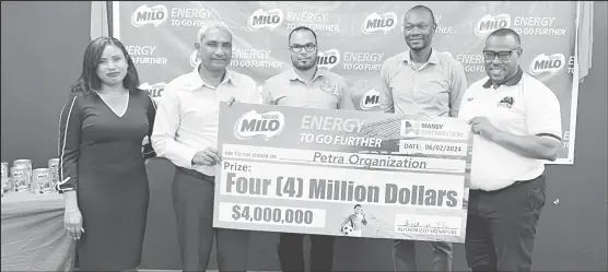  ?? ?? Nestle’s Senior Business Manager Teisha Milner (1st from left), Massey CEO Navin Thakur (2nd from left), Nicholas Fraser (centre), Administra­tor of the Allied Arts Unit, GFF Vice-President Dion Innis (4th from left), and Petra Organisati­on’s Co-Director Troy Mendonca pose for the cameras at the launch of the 10th Milo Schools U-18 Football Tournament