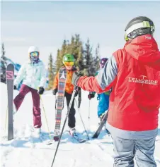  ?? Provided by Telluride Ski Resort ?? Kids get a ski lesson from the Ski and Snowboard School at Telluride in 2013.