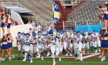  ?? SUBMITTED PHOTOS ?? The 2018 Sheridan Yellowjack­ets run onto the field for their season opener at War Memorial Stadium in Little Rock. The team won the game, 34-7.